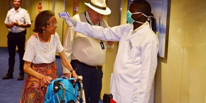 A tourist is screened for Coronavirus at the Port of Mombasa on February 13, 2020 